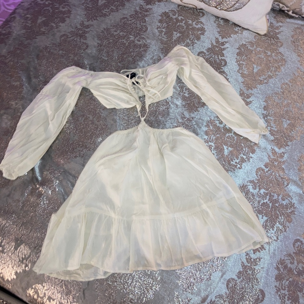 White dress, that is more like a crop top and skirt set that is connected.